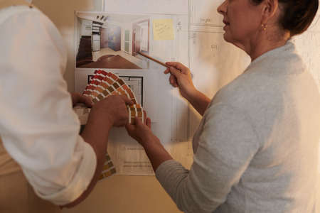 Team of interior designers discussing color palette for new projectの写真素材