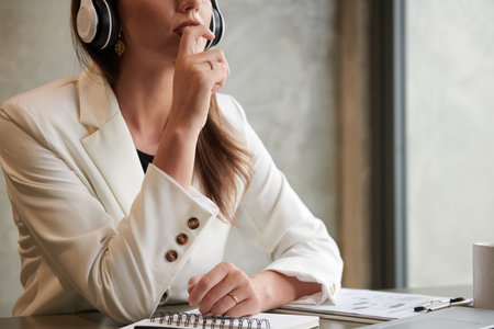 Cropped image of pensive female entrepreneur trying to find solutionの写真素材