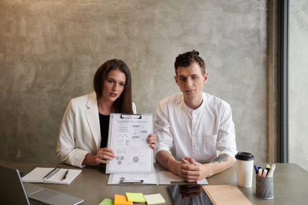 Business team showing report with charts to colleague during online meeting