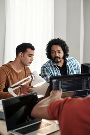 Programmers discussing new releasing new feature on website