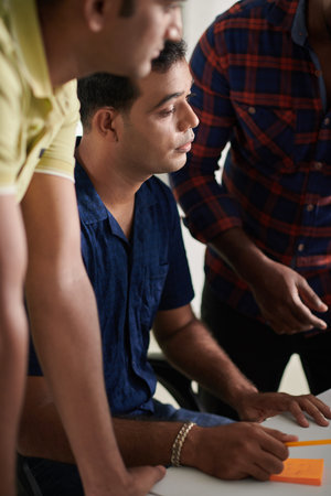 Team of UX designers working on interface of new mobile applicationの写真素材