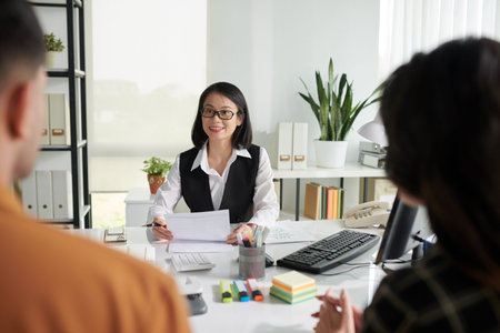 Insurance agent answering questions of couple
