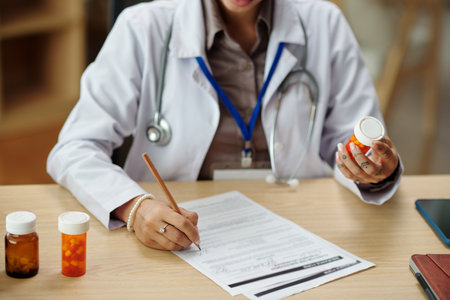 General practitioner prescribing new medicine to patientの写真素材