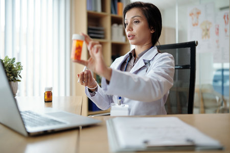 Pharmaceutical company director talking about new medicine in online meetingの写真素材
