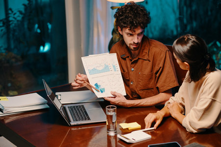 Entrepreneur showing pie chart in report to colleague when they are analyzing startup successの写真素材