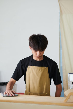 Barista wiping counter before opening coffeeshop