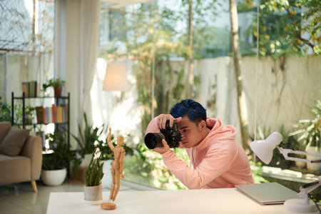 Talented photographer photographing objects on table