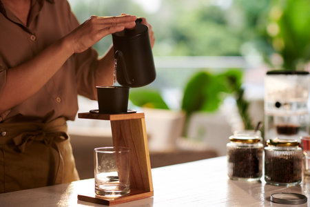 Closeup image of barista making Vietnamese style coffee for customerの写真素材
