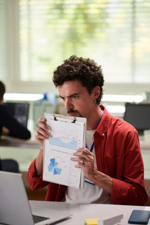 Businessman showing report at online meeting with colleagues