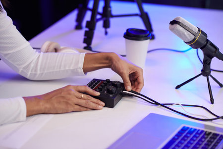 Hands of blogger setting amplifier before recording video for social mediaの写真素材