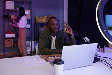 Online shop owner recording cosmetics review for social media accountの写真素材