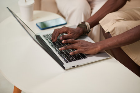 Hands of Black woman searching for new online shops and marketplacesの写真素材