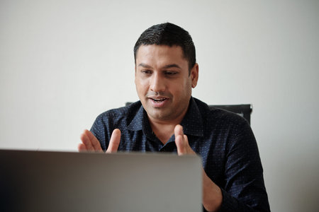 Excited businessman explaining idea at meeting with investores