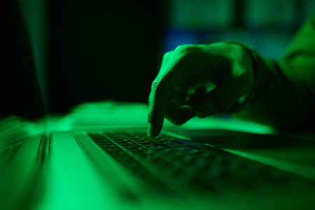 Closeup image of developer pressing button to launch program