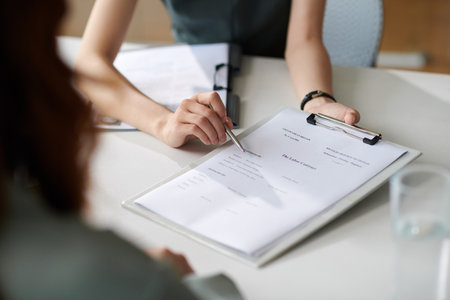 HR manager asking new employee to fill labor contractの写真素材