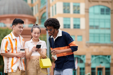 Group of friends using mobile application when searching how to get to national historic siteの写真素材