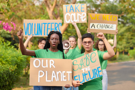 Group of activists protesting with placards asking to take care of the planetの写真素材