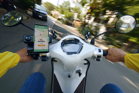 Motorbike taxi driver riding fast to new client, blurred motion