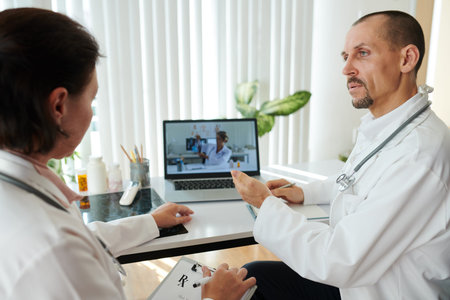 Group of doctors discussing medical prescription for patient