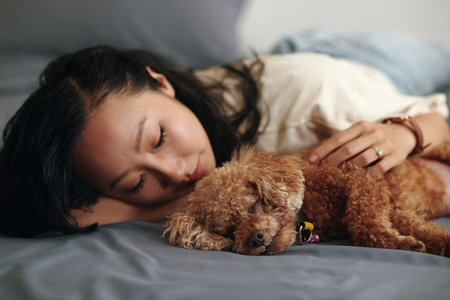 Chinese young woman fell asleep hugging her dog