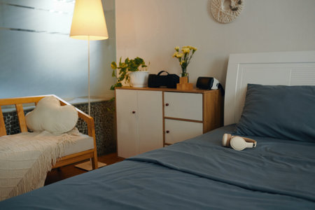 Interior of small cozy bedroomの写真素材