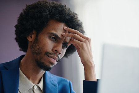 Portrait of passive tired businessman pondering over business problemの写真素材