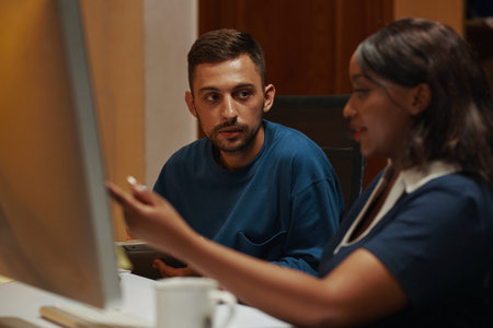 Manager looking at coworker explaining ideas on project development