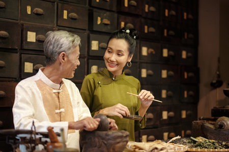 People Preparing Herbs For Sale In Asian Drug Storeの写真素材