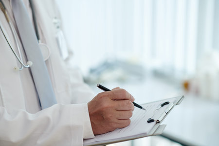 Doctor Prescribing Medicine To Patientの写真素材