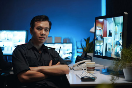 Security Worker Sitting In Security Room