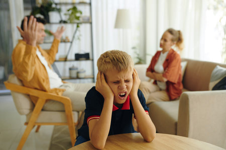 Child Sick and Tired Of Family Conflictsの写真素材