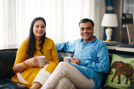Happy Indian Couple Drinking Teaの写真素材