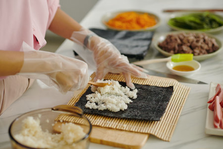 Woman Making Korean Kimbap At Homeの写真素材