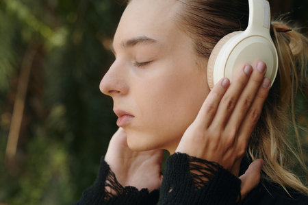 Model Enjoying Music In Headphones