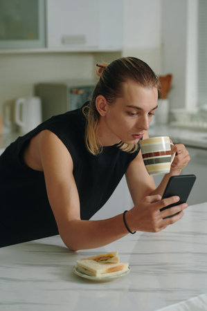 Model Drinking Coffee And Checking News