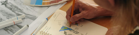 Fashion Designer Drawing In Sketchbook