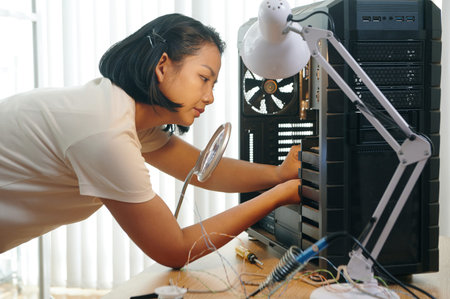 Technician Building PC Computer In Workshop