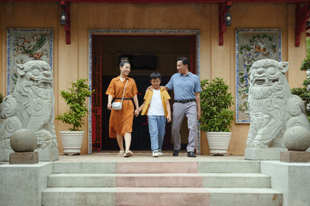 Parents With Son Visiting Templeの写真素材