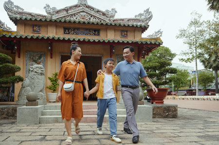 Family With Son Visiting Old Templeの写真素材