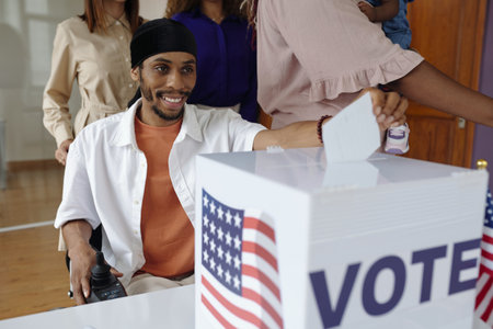 Man Putting Bulletin In Boxの写真素材