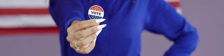 Young Woman Holding Patriotic Pin