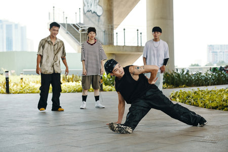 Breakdancer Performing in Urban Setting with Onlookersの写真素材