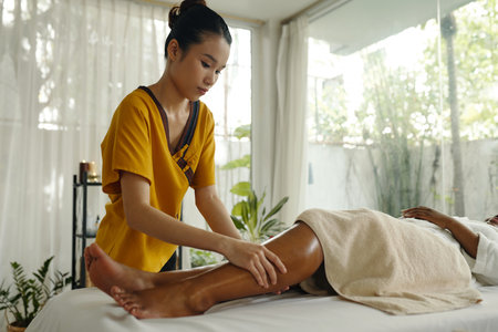 Performing Relaxing Massage Therapy in Peaceful Settingの写真素材