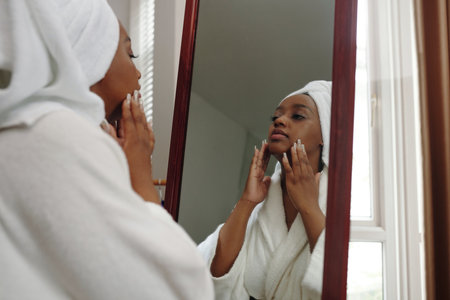 Reflecting in Mirror After Shower Routineの写真素材