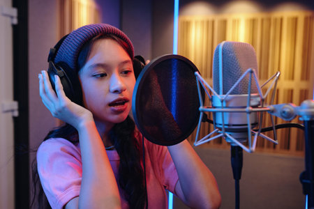 Capturing Young Talent Singing in Professional Studioの写真素材