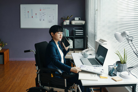 Manager With Disability Working In Officeの写真素材