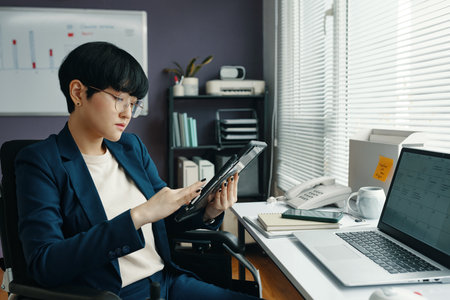 Businesswoman Working Online On Tablet PCの写真素材