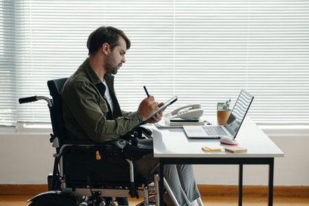 Man Doing Online Work On Tablet PCの写真素材