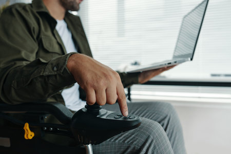 Man With Disability Controlling The Wheelchairの写真素材