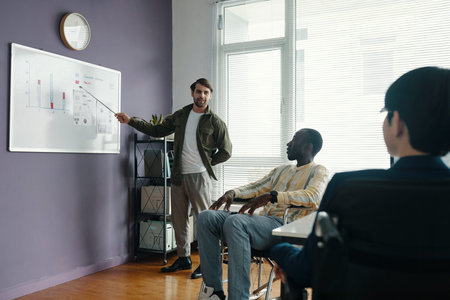 Businessman Presenting Report To His Colleagues